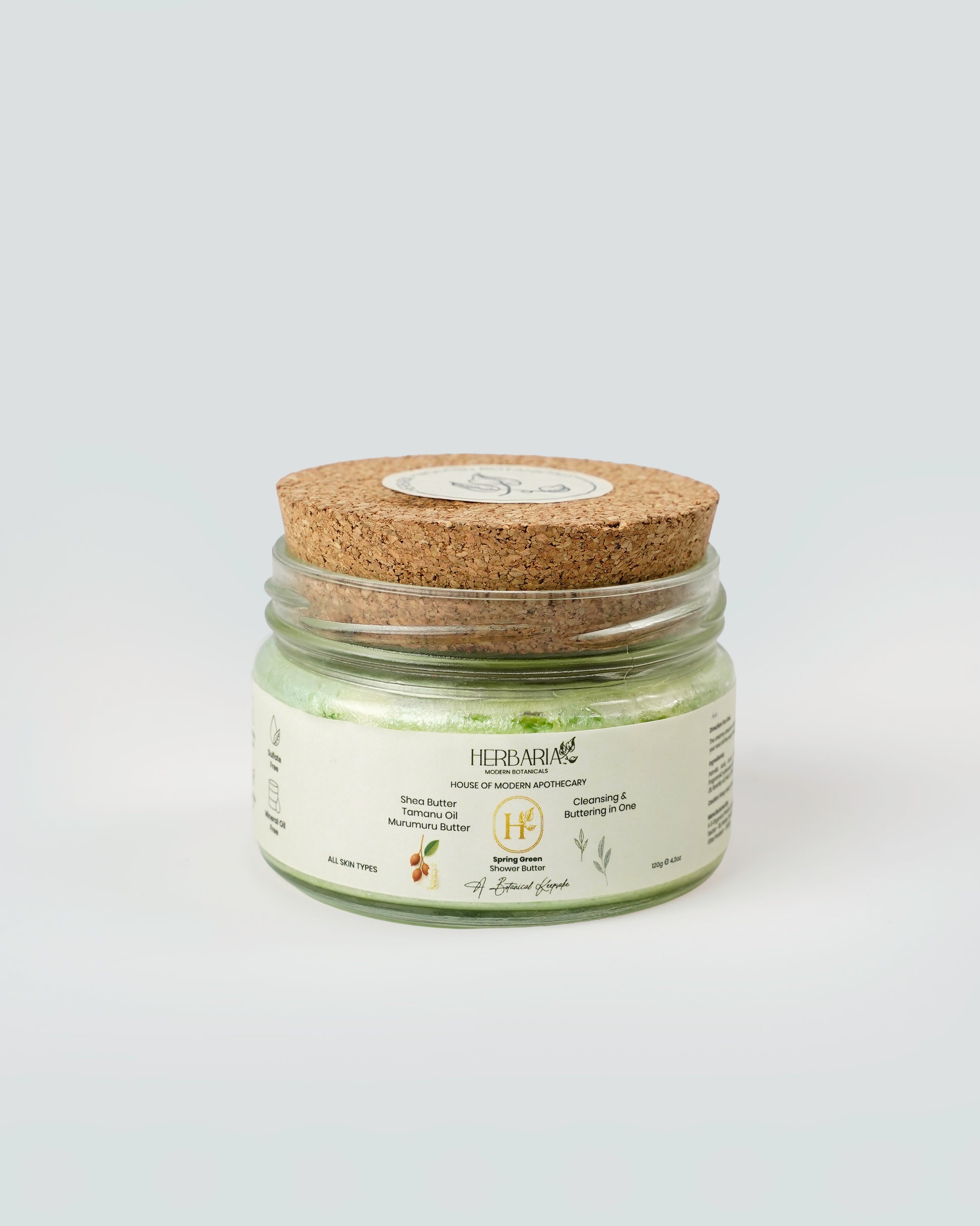 Jar of bath salts with a cork lid on a white background